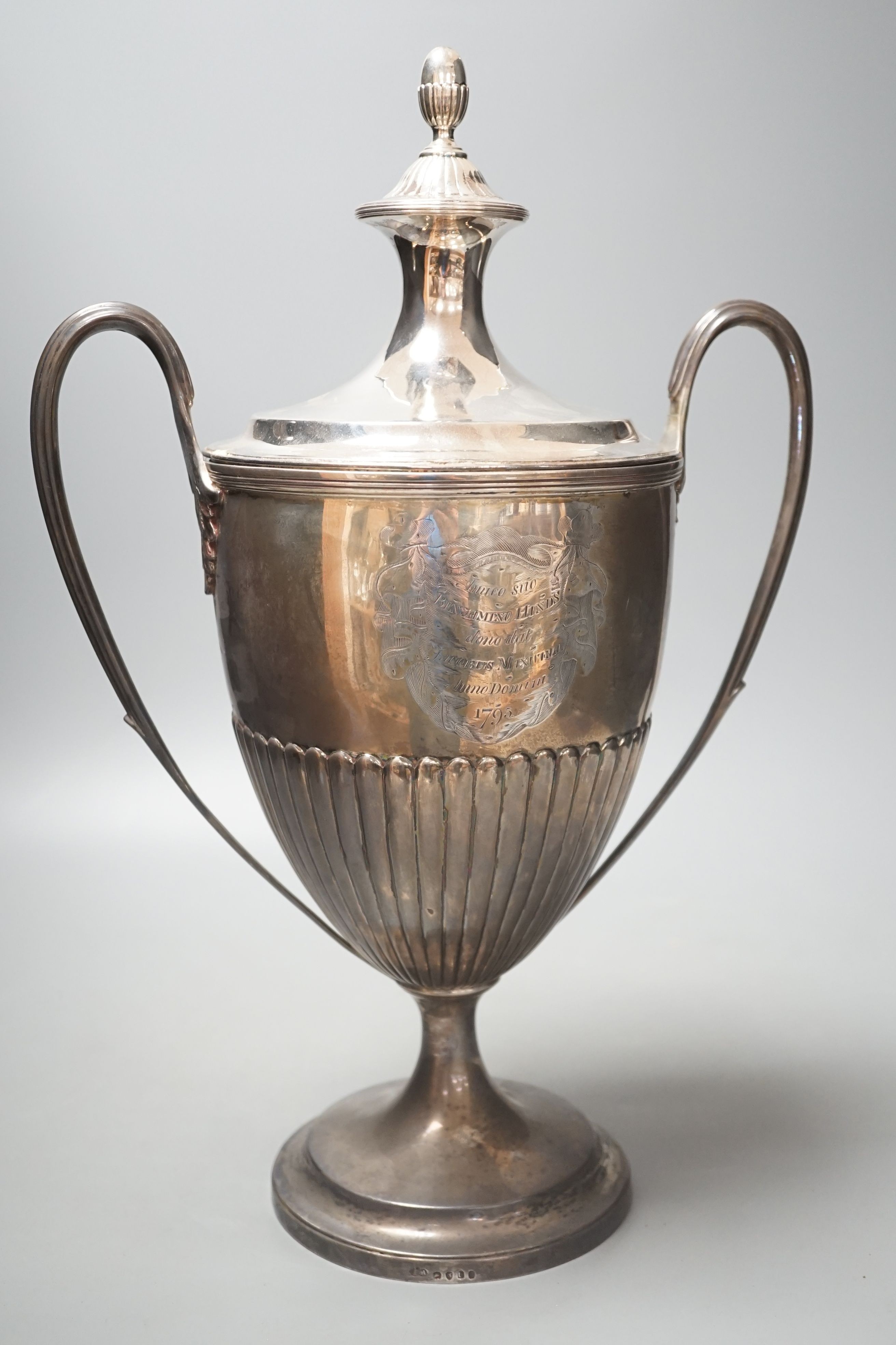 A George III demi fluted silver two handled urn shaped pedestal presentation trophy cup and cover, by William Fountain